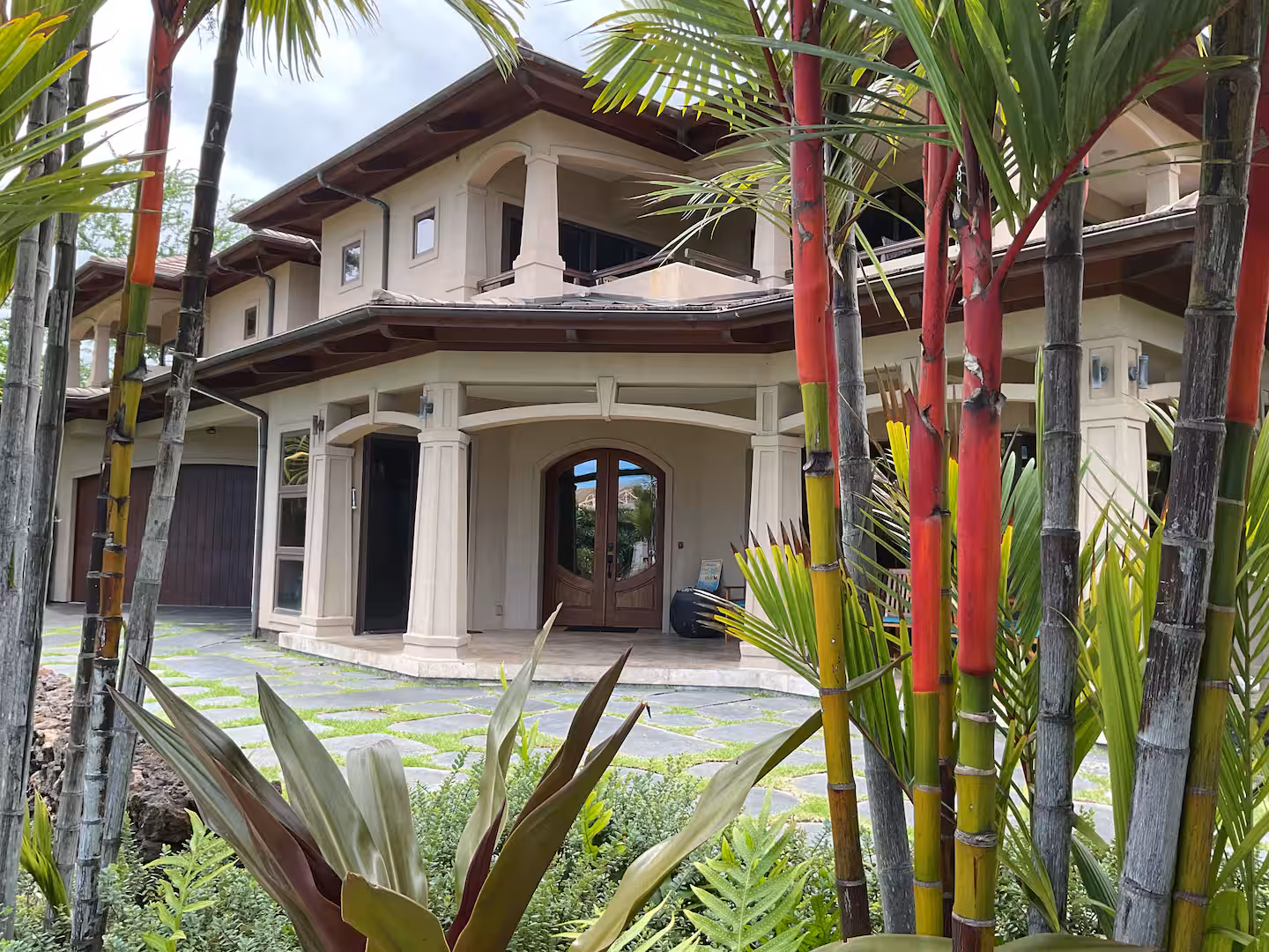 Shining Seas — gated Kailua-Kona estate framed by palms